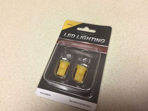 2002 Pontiac Grand Prix - A blister pack of two amber Diode Dynamics LED bulbs, model 2X194-SMD2A, is shown on a speckled countertop.