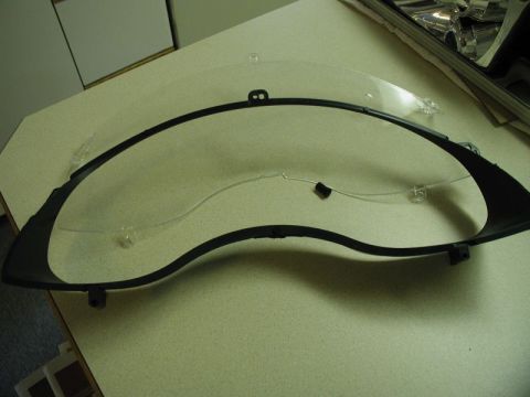 2002 Pontiac Grand Prix - With the cluster out of the vehicle, remove the lens and plastic surround.