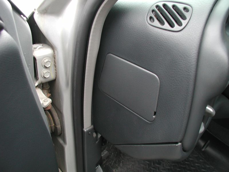 Remove the access cover on the left side of the dash.