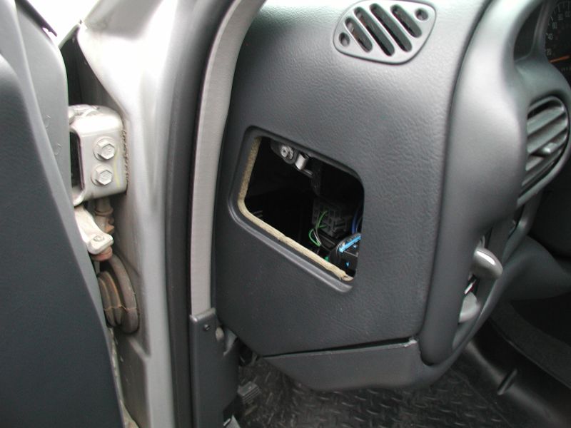 Remove the access cover on the left side of the dash.