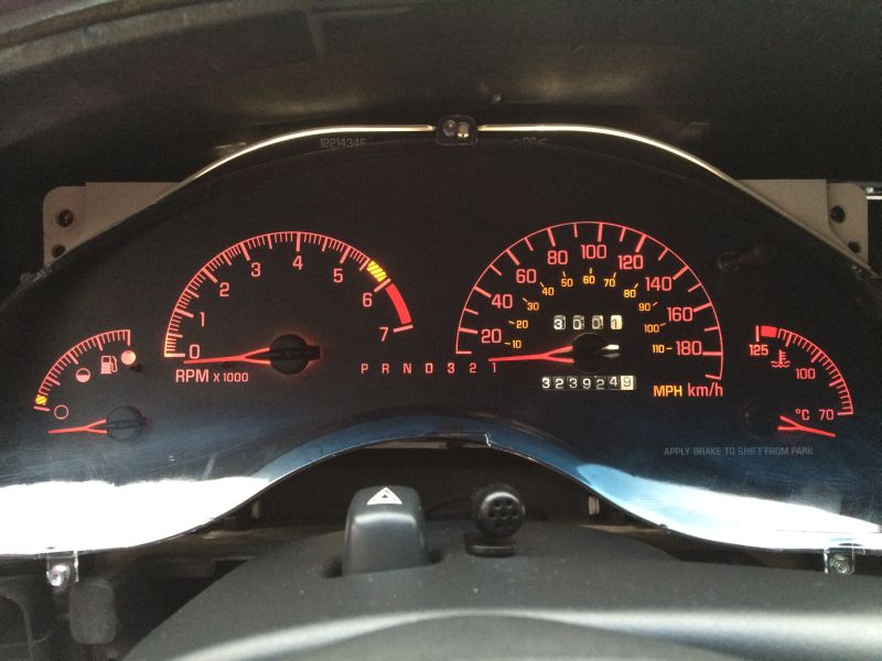 Pontiac Grand Prix dashboard instrument cluster with odometer reading 3239249.