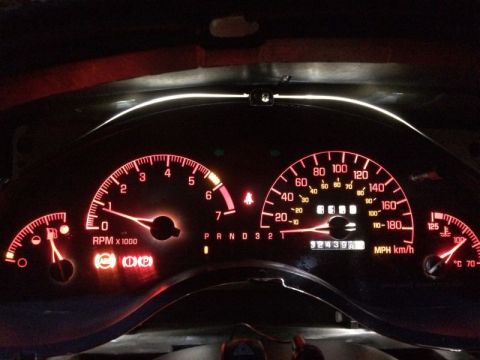 2002 Pontiac Grand Prix - Car on, dash lights on, signals dimly lit.