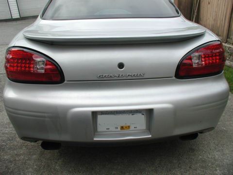 2002 Pontiac Grand Prix - The rear view of a silver 2002 Pontiac Grand Prix is shown, featuring its taillights, spoiler, and a British Columbia license plate.