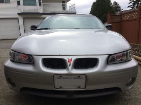 2002 Pontiac Grand Prix - Ran the wires for the demon eyes; went through the firewall at a grommet to the left of the steering column, got chassis ground from a stud…