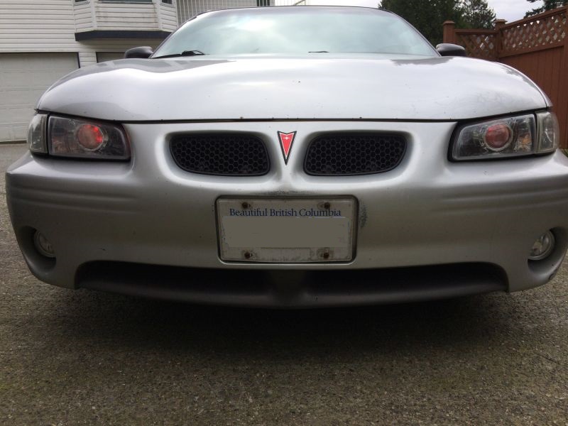 Silver 2002 Pontiac Grand Prix front view with license plate