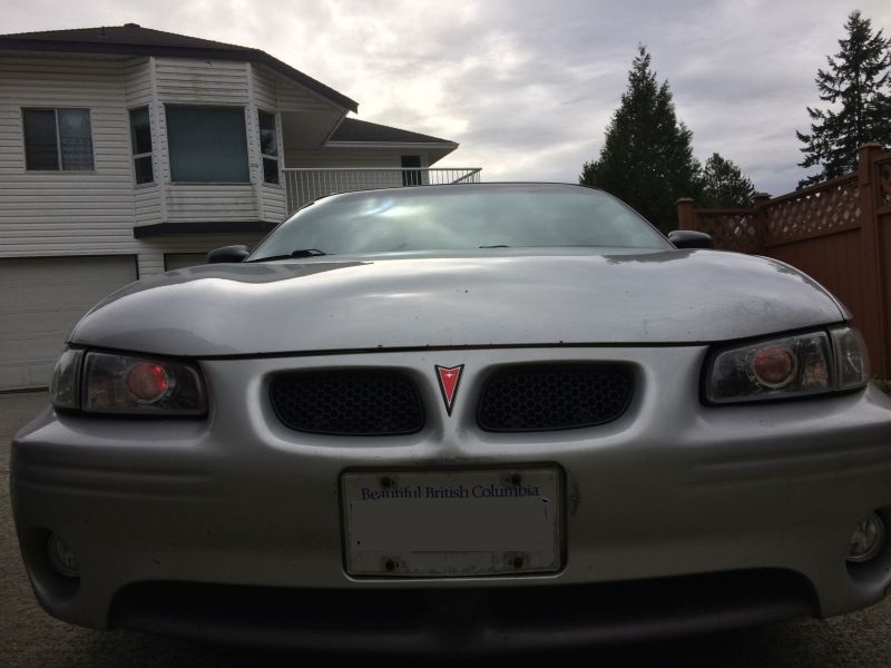 Silver Pontiac Grand Prix front view with license plate
