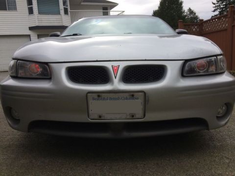 2002 Pontiac Grand Prix - Ran the wires for the demon eyes; went through the firewall at a grommet to the left of the steering column, got chassis ground from a stud…