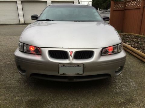 2002 Pontiac Grand Prix - Ran the wires for the demon eyes; went through the firewall at a grommet to the left of the steering column, got chassis ground from a stud…