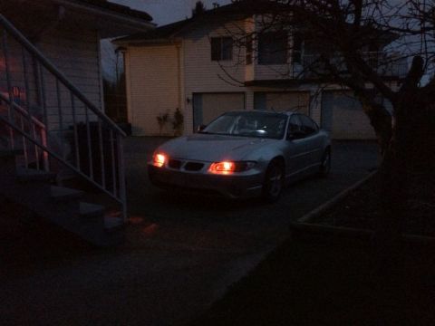 2002 Pontiac Grand Prix - Ran the wires for the demon eyes; went through the firewall at a grommet to the left of the steering column, got chassis ground from a stud…