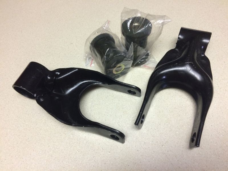 Black metal control arms and rubber bushings