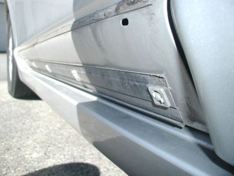 2002 Pontiac Grand Prix - The bottom of the molding sits in a channel at the bottom of the door.