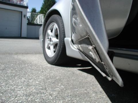 2002 Pontiac Grand Prix - The bottom of the molding sits in a channel at the bottom of the door.