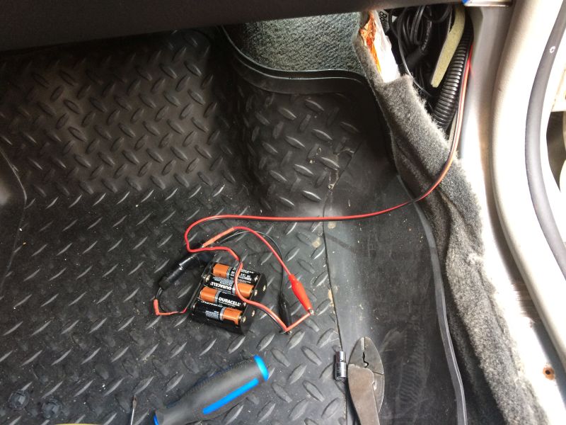 Right front, door re-assembled, wiring run to kick panel, lit with power supply.