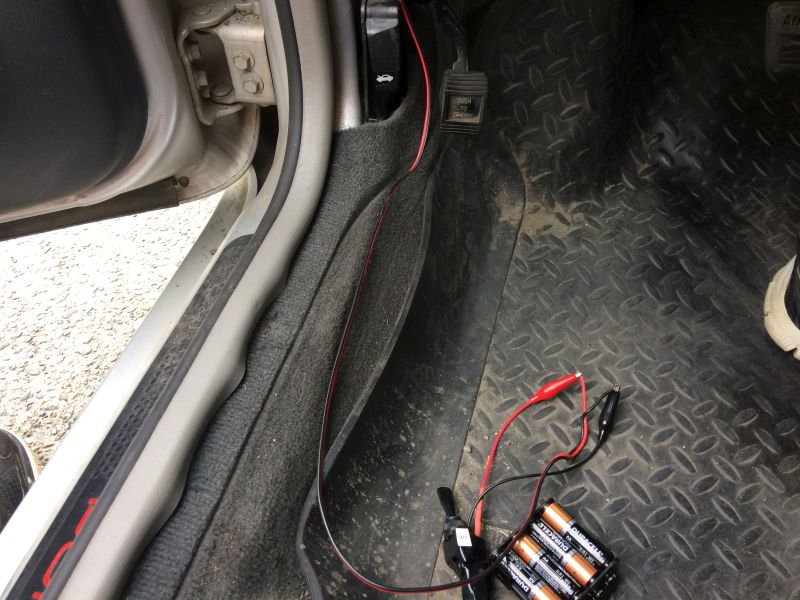 Left front, door re-assembled, wiring run to kick panel, lit with power supply.