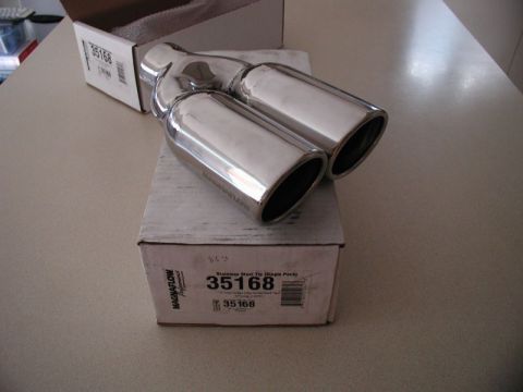 2002 Pontiac Grand Prix - A dual exhaust tip with a polished chrome finish rests on top of its original packaging box. The box displays the Magnaflow Performance log…