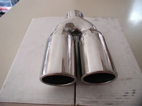 2002 Pontiac Grand Prix - A polished chrome dual exhaust tip is shown resting on a white cardboard box. The exhaust tip has two outlets that merge into a single inle…