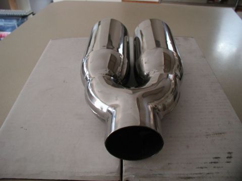 2002 Pontiac Grand Prix - A polished chrome dual exhaust tip is shown resting on a white cardboard box. The exhaust tip has a Y-shaped design where two pipes merge i…