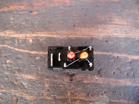 2002 Pontiac Grand Prix - Unsolder the orange bulb from the hi beam +/- terminal and solder it to the red bulb - terminal.