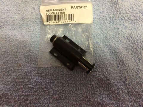 2002 Pontiac Grand Prix - A black replacement touch latch with a part number label is shown on a blue textured surface.