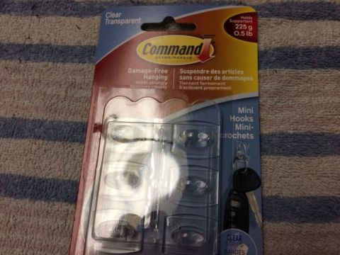2002 Pontiac Grand Prix - A package of Command Mini Hooks is shown against a striped blue and white fabric background. The packaging includes text in English and Fre…