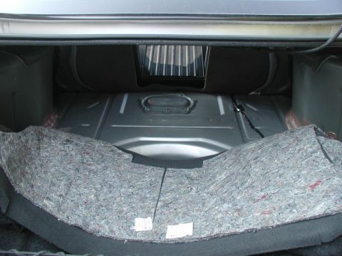 2002 Pontiac Grand Prix - Pull back the carpet in the trunk to expose the access panel.