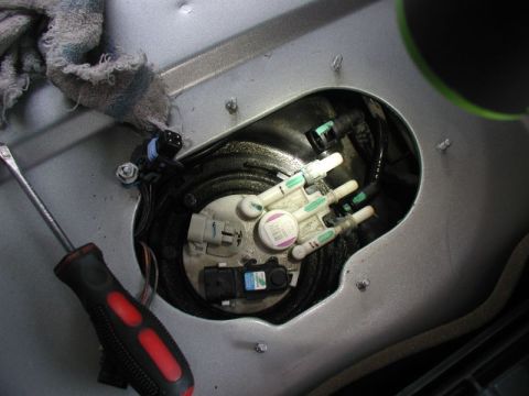 2002 Pontiac Grand Prix - Disconnect the three fuel lines. For the two outer hoses, squeeze the two tabs inward and pull the hose off. For the inner hose, squeeze th…