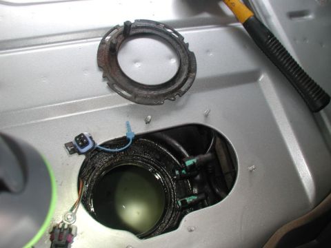 2002 Pontiac Grand Prix - Remove the lock ring; rotate counter clockwise until it clears the 4 lock tabs.