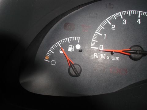2002 Pontiac Grand Prix - This is a close-up shot of the dashboard gauges of a 2002 Pontiac Grand Prix. The image shows the fuel gauge and the tachometer.