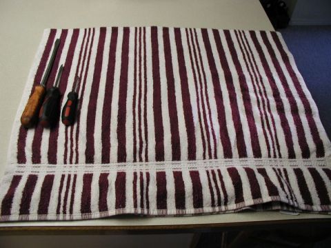 2002 Pontiac Grand Prix - Three screwdrivers are laid on a striped towel.