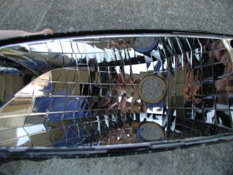 2002 Pontiac Grand Prix - Remove the metal piece that surrounded the light bulb.