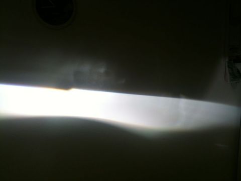 2002 Pontiac Grand Prix - Holding the projector in the housing; I was able to get it sitting where it needed to be.