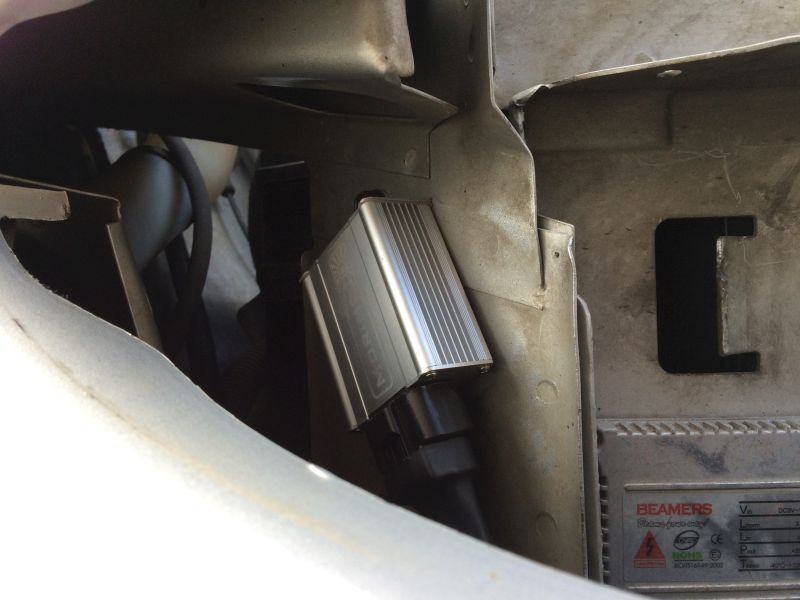 Relay mounted in behind the right fender.