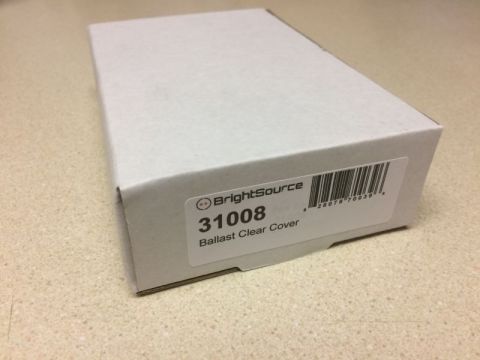 2002 Pontiac Grand Prix - A white cardboard box with a label indicating "BrightSource 31008 Ballast Clear Cover" and a barcode is placed on a speckled countertop.