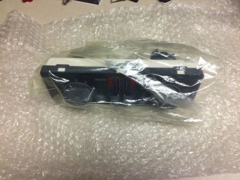 2002 Pontiac Grand Prix - A black and white climate control unit for a vehicle is shown, wrapped in bubble wrap. The unit has knobs and sliders for temperature and f…