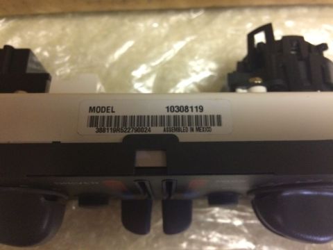 2002 Pontiac Grand Prix - A close-up view of a white label on a vehicle part that reads "MODEL 10308119" with a barcode and "ASSEMBLED IN MEXICO" below it.