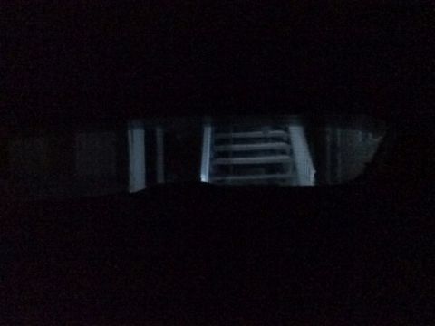 2002 Pontiac Grand Prix - Looking out the back window from the drivers seat; reverse lights on.