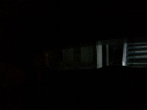 2002 Pontiac Grand Prix - Looking out the back window from the drivers seat; reverse lights on.