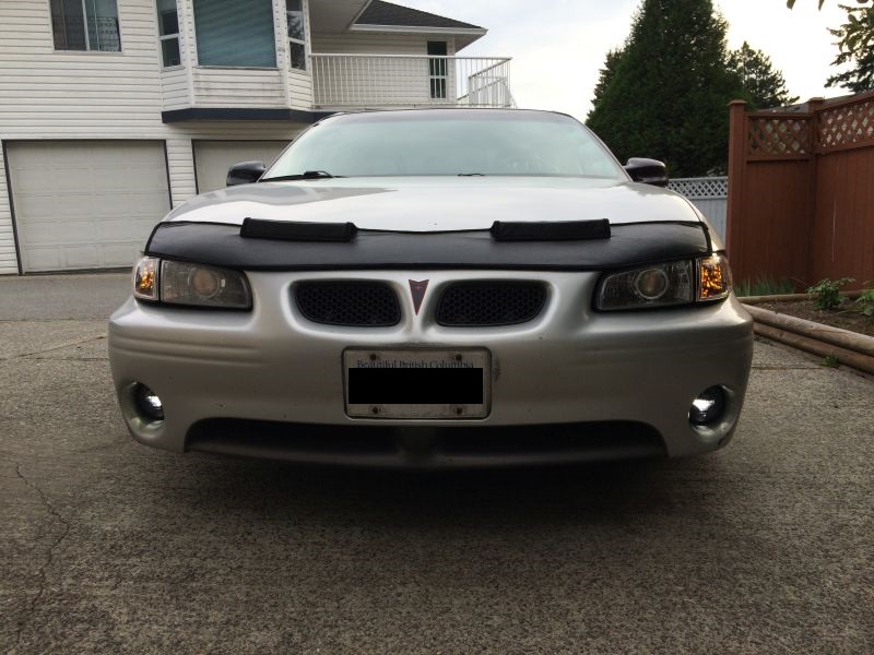Silver 2002 Pontiac Grand Prix front view with black hood bra