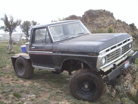 1978 Ford Bronco - This modified Ford F-Series truck, likely from the mid-1970s, is equipped for off-road use.