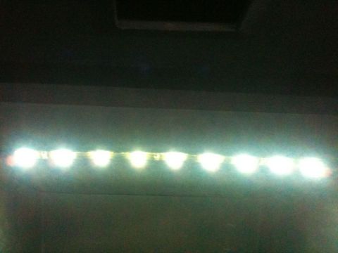 2002 Pontiac Grand Prix - A strip of white LED lights is mounted horizontally across a dark wall.