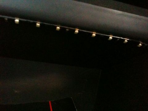 2002 Pontiac Grand Prix - A close-up view shows a strip of small LED lights installed along the top edge of a dark interior panel, likely in a vehicle's trunk or sto…