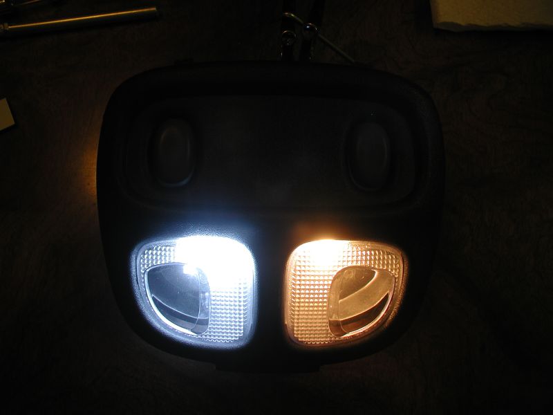Overhead console with two lights, one white and one amber.