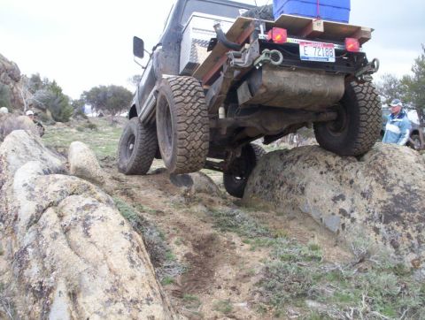1978 Ford Bronco - Off-road vehicle navigating rocky terrain, with another vehicle visible in the background.