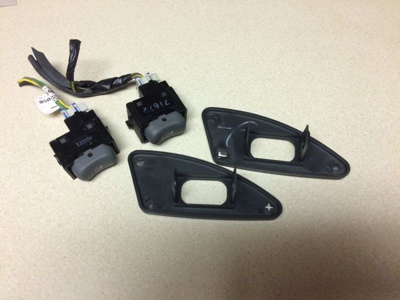 Foglight switches with mounting bezels; remove the switches.