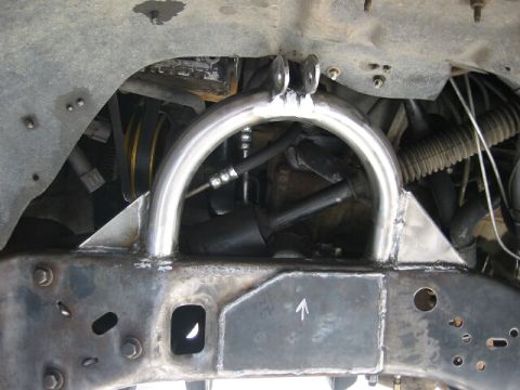 1994 Ford Bronco - Close-up of a custom suspension part, possibly for off-road modification.