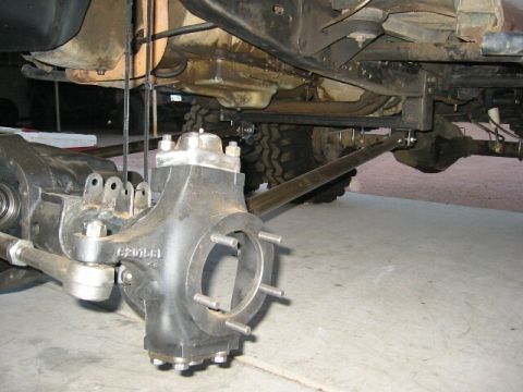 1994 Ford Bronco - Vehicle axle and suspension parts are shown in detail, with some part numbers visible on the casting.