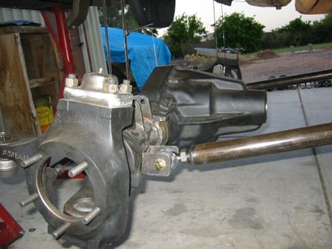 1994 Ford Bronco - The image displays a close-up view of a vehicle's axle and suspension system, likely undergoing maintenance or modification.