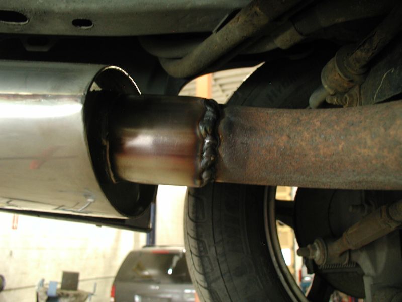 New mufflers welded in place.