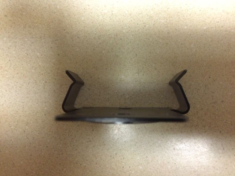 Metal clip with upward-pointing prongs