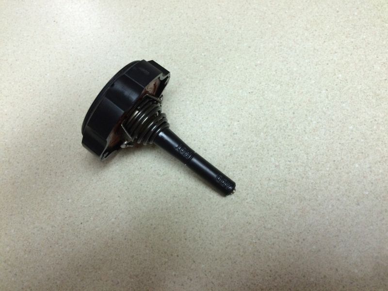 Black rotary potentiometer with spring and "AUDIO" text